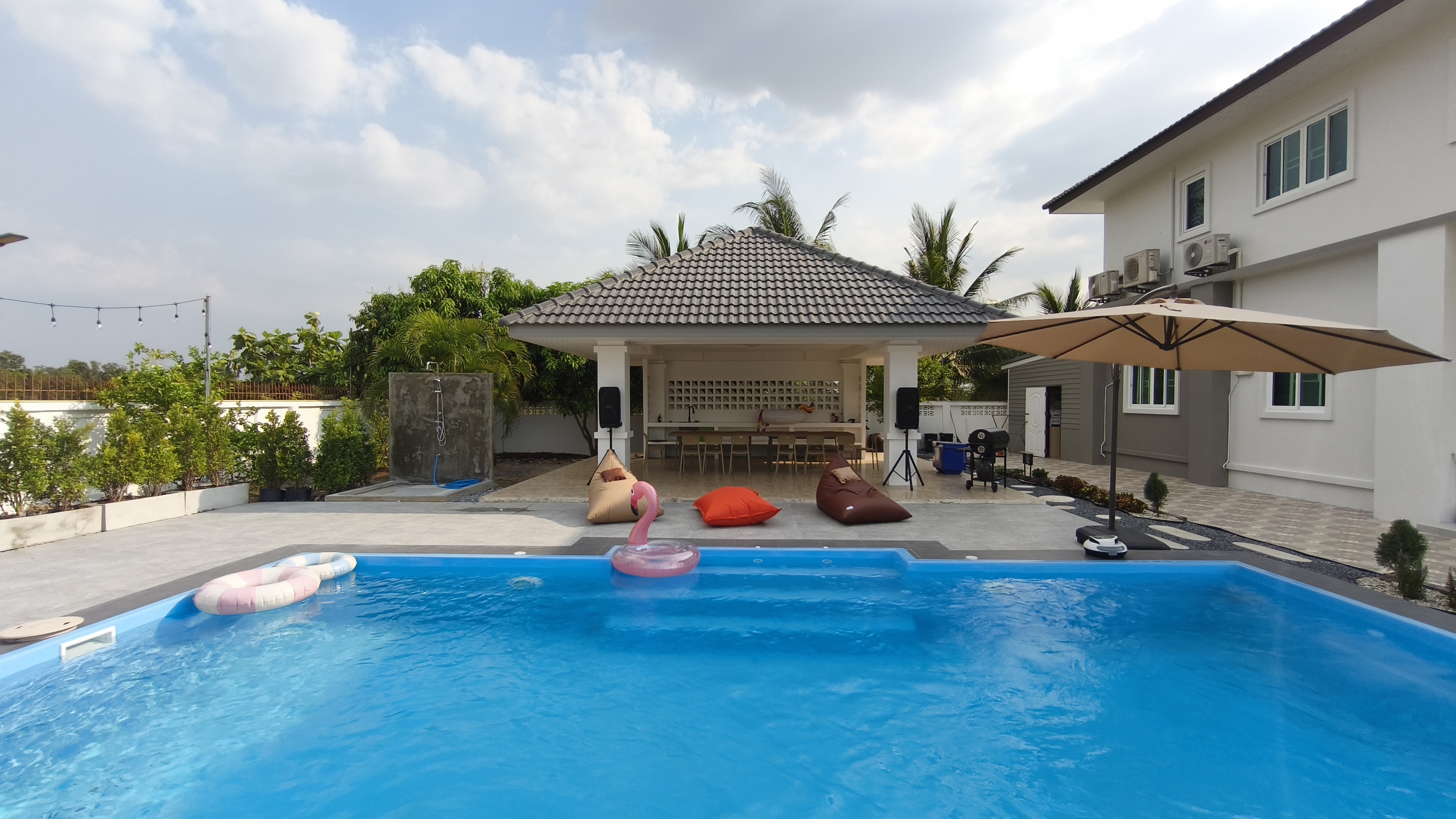 Luxury pool villa exterior with swimming pool and modern architecture